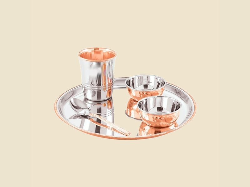 Steel and Copper Round Thali Set on a warm ivory background