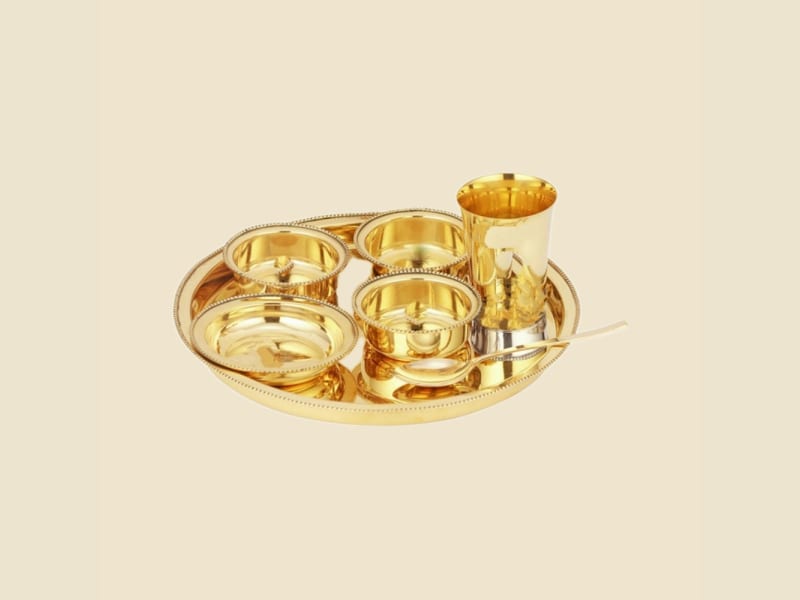 Brass Goldcraft Thali Set on a warm ivory background