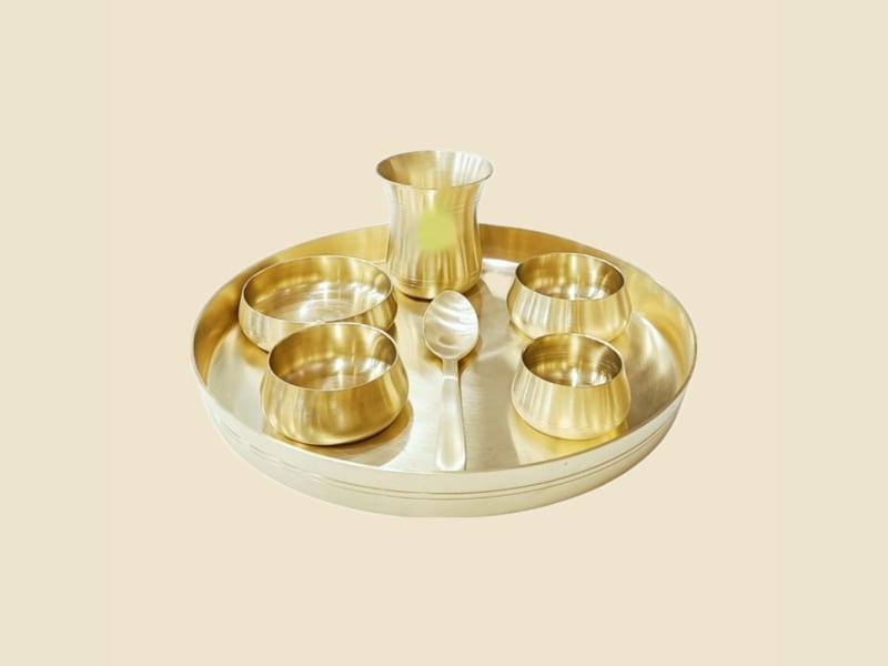 Brass Deluxe Thali Set on a warm ivory background