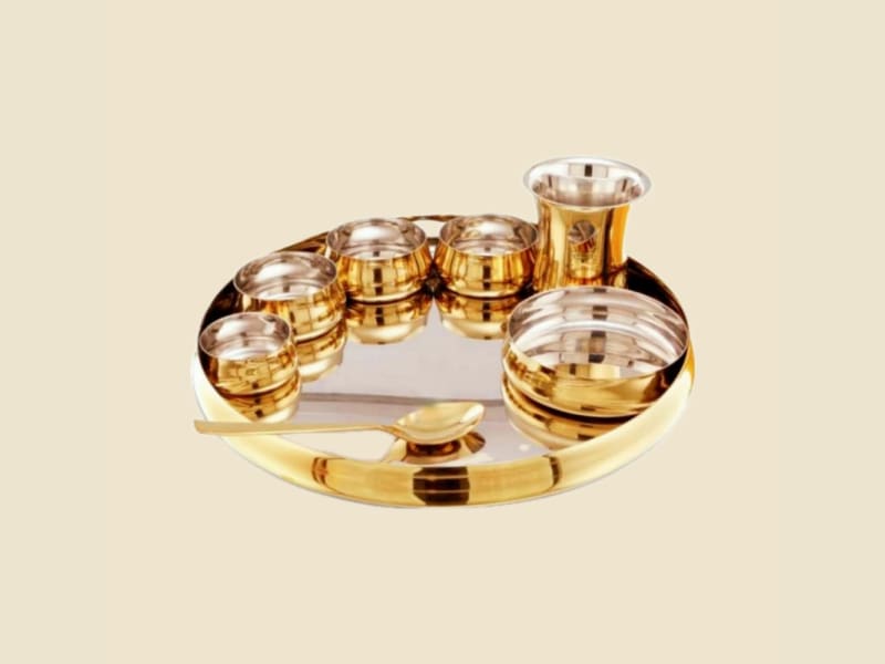 Steel and Brass Curve Thali Set on a warm ivory background