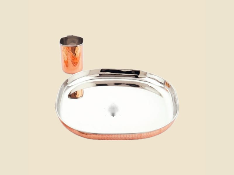 Steel and Copper Oval Thali Set on a warm ivory background