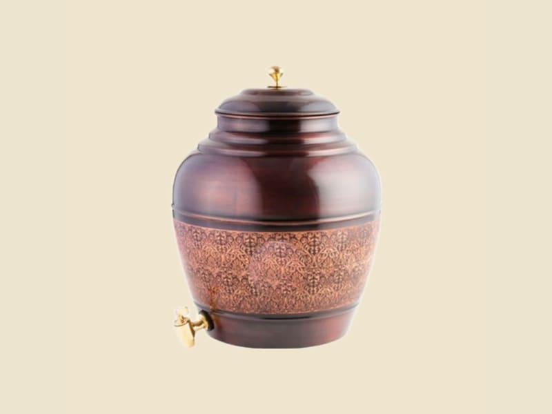 Copper Apple Antique Water Dispenser on a warm ivory background
