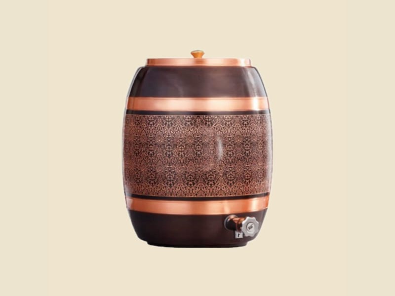 Barrel Antique Copper Water Dispenser on a warm ivory background