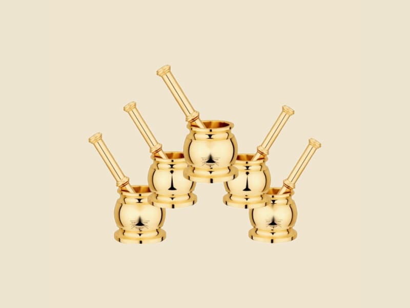 Brass Matki Khalbatta (Mortar and Pestle) on a warm ivory background