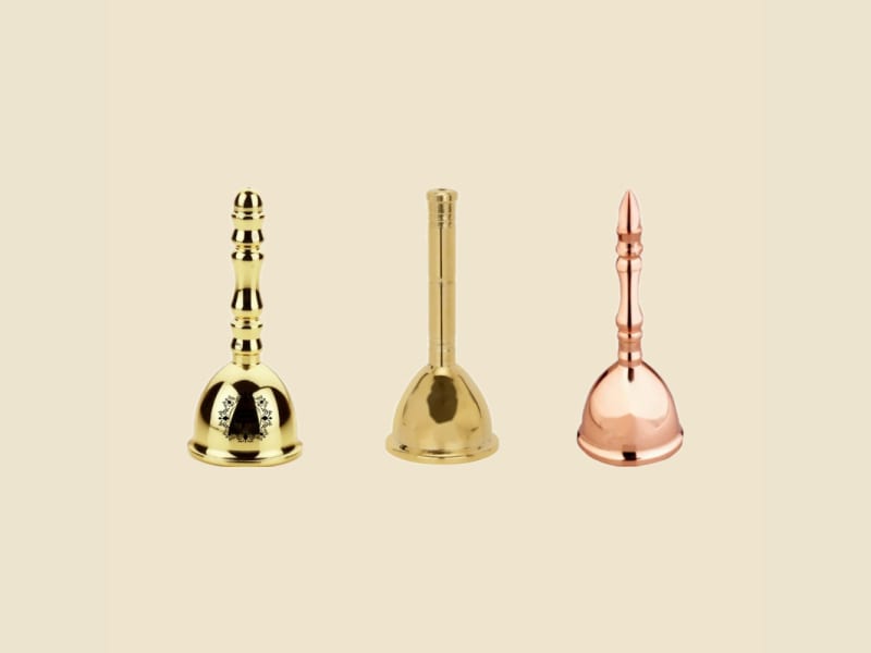 Brass Rajwadi Puja Ghanti on a warm ivory background