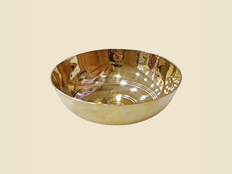 Brass Tasla on a warm ivory background