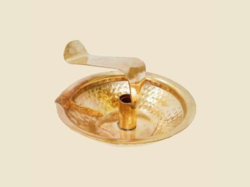 Hammered Copper Jibh Codiya on a warm ivory background