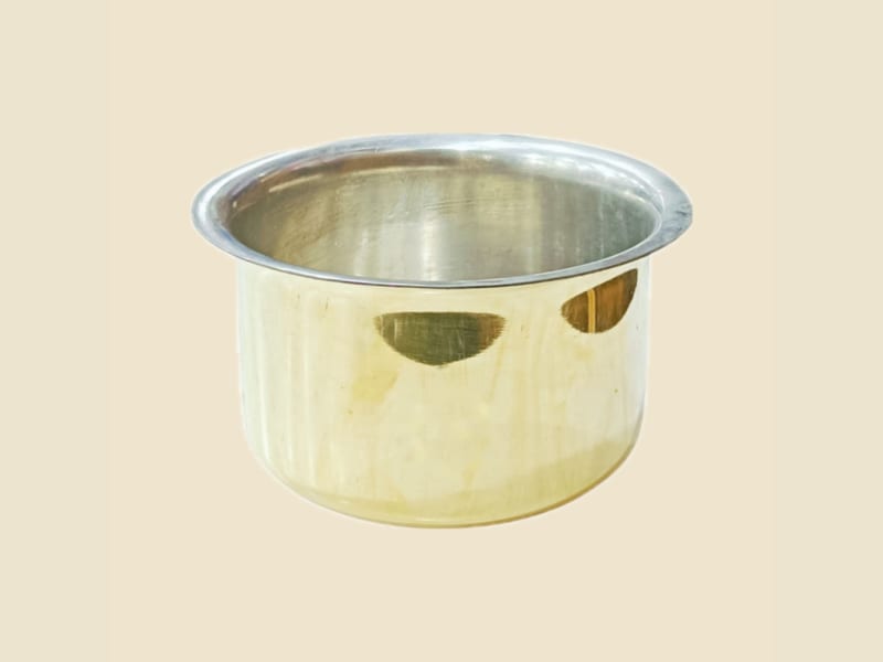 Brass Top (Patila) with Kalai Lining on a warm ivory background