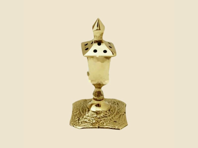 Brass Agardan Chakor on a warm ivory background