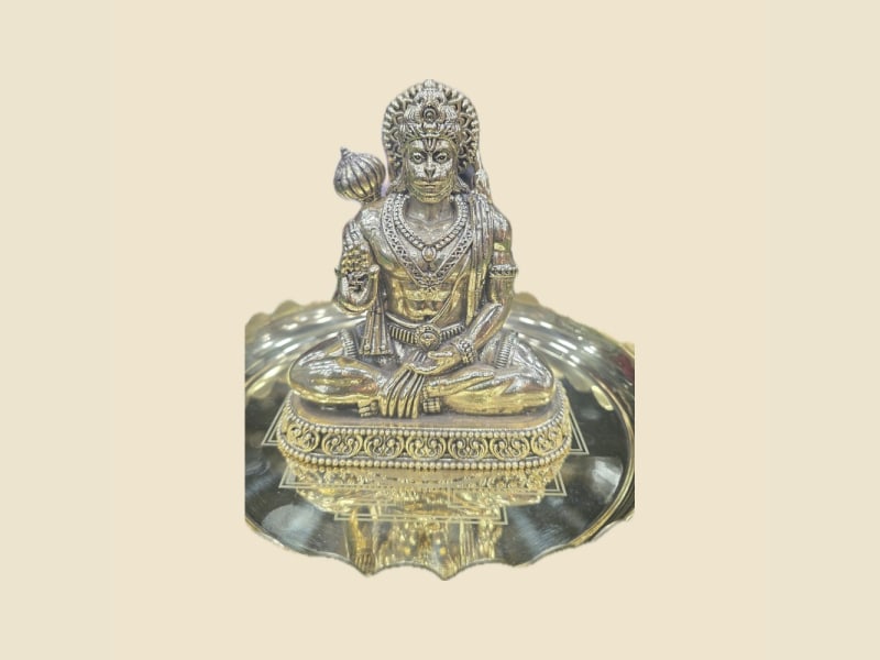 Brass Seated Hanuman with Gada, Antique Finish on a warm ivory background