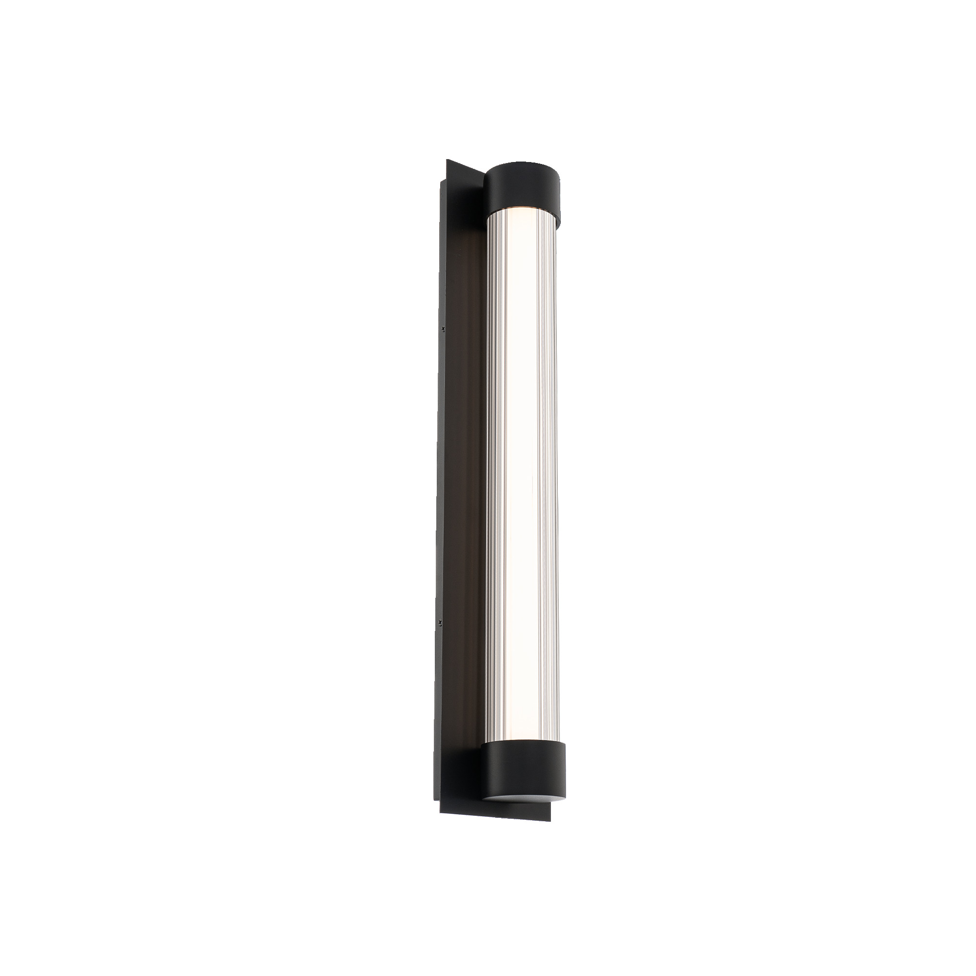 Enhance your façade with the Chyzel outdoor wall light, a polished black rectangle framing a clear column of linear rippled glass. Integrated, color temperature selectable LEDs provide textured illumination that radiates outward, while soft up and down lighting emerges from the top and bottom of the column. Chyzel is offered in 18 and 25-inch sizes and is finished in bold black.