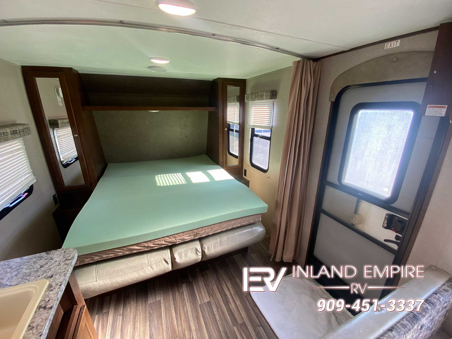 Queen bed in the 2018 Keystone Hideout 21LHSWE Travel Trailer RV