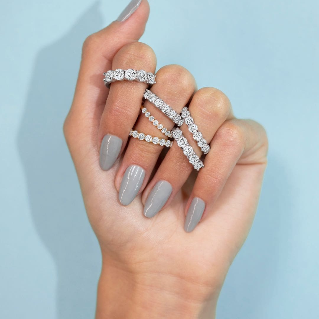 Eternalle lab-grown diamond rings stacked on a hand