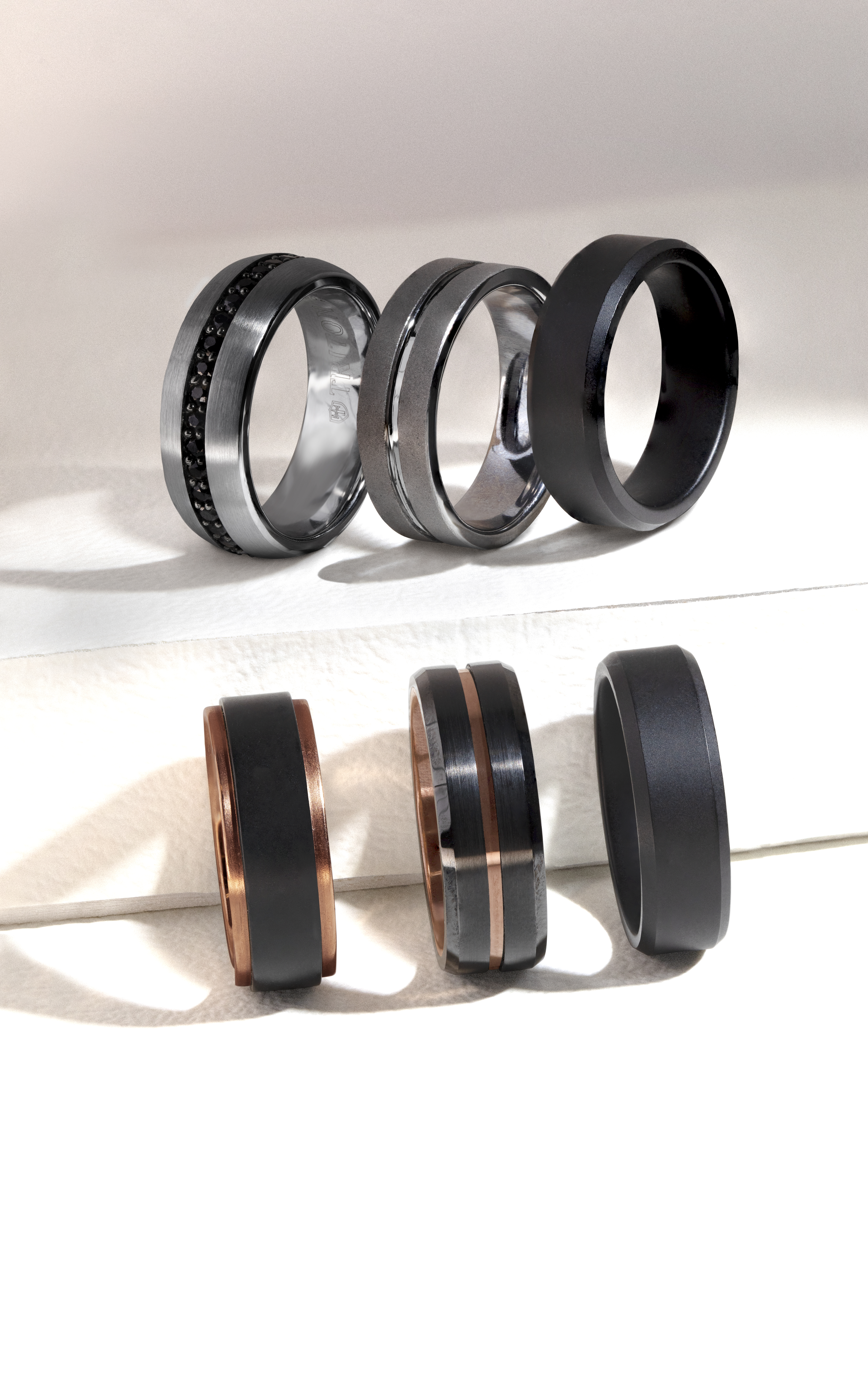 Triton black tungsten and rose gold men's wedding bands