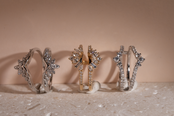 Diamond ring enhancers and solitaire guards in white and yellow gold
