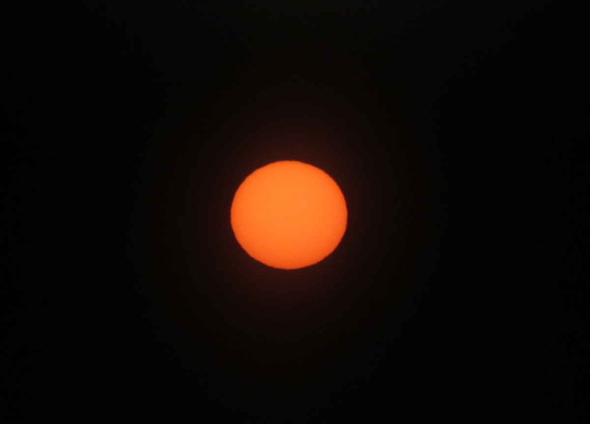 The sun through eclipse glasses