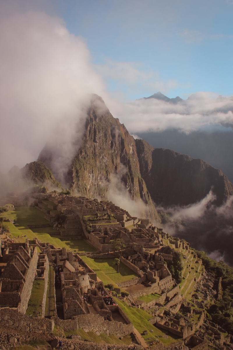 Magical Machu Picchu breaking through the early morning clouds