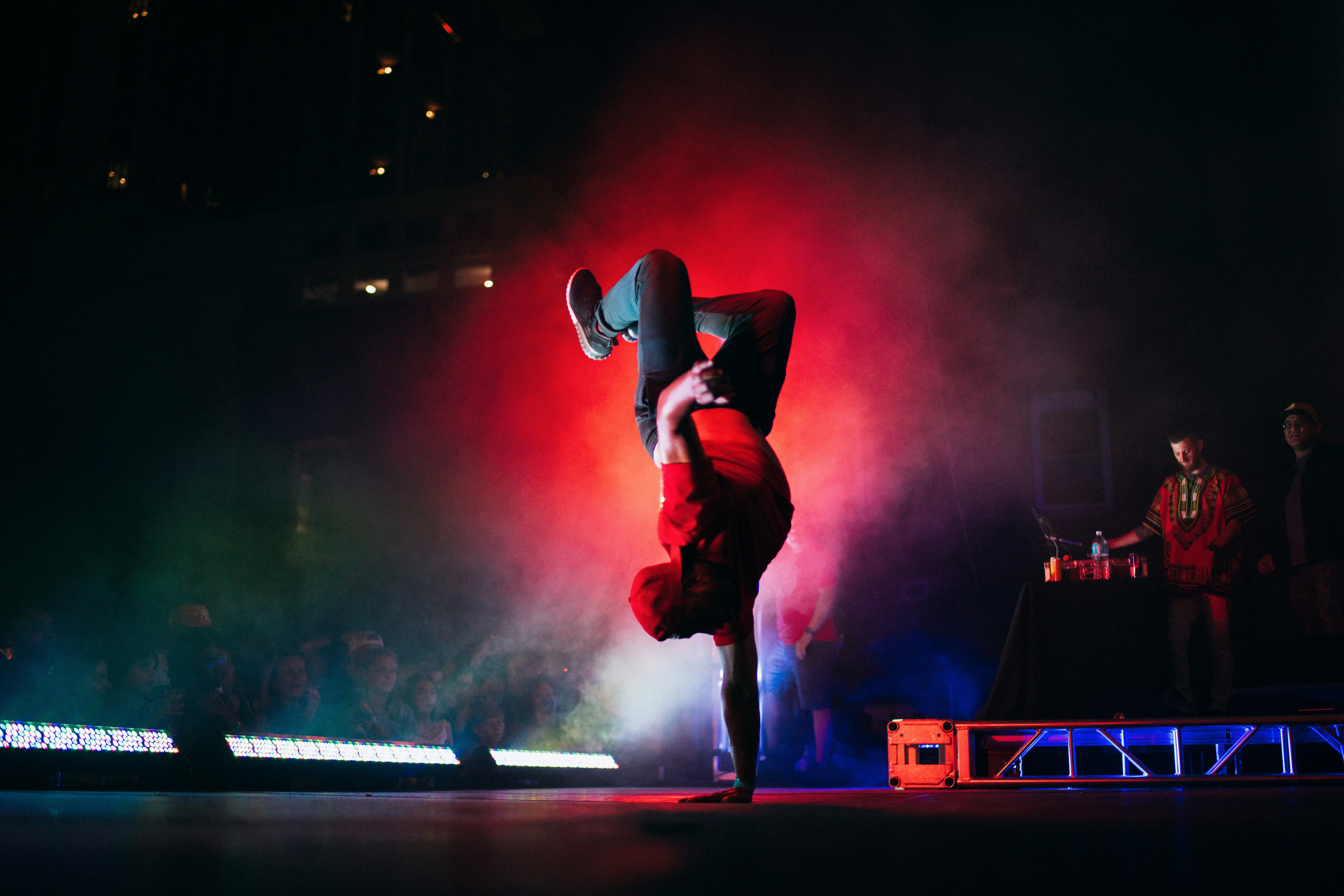 Smartphone screen with IdoMetrics challenge feed displaying thumbnails of dance covers and challenges