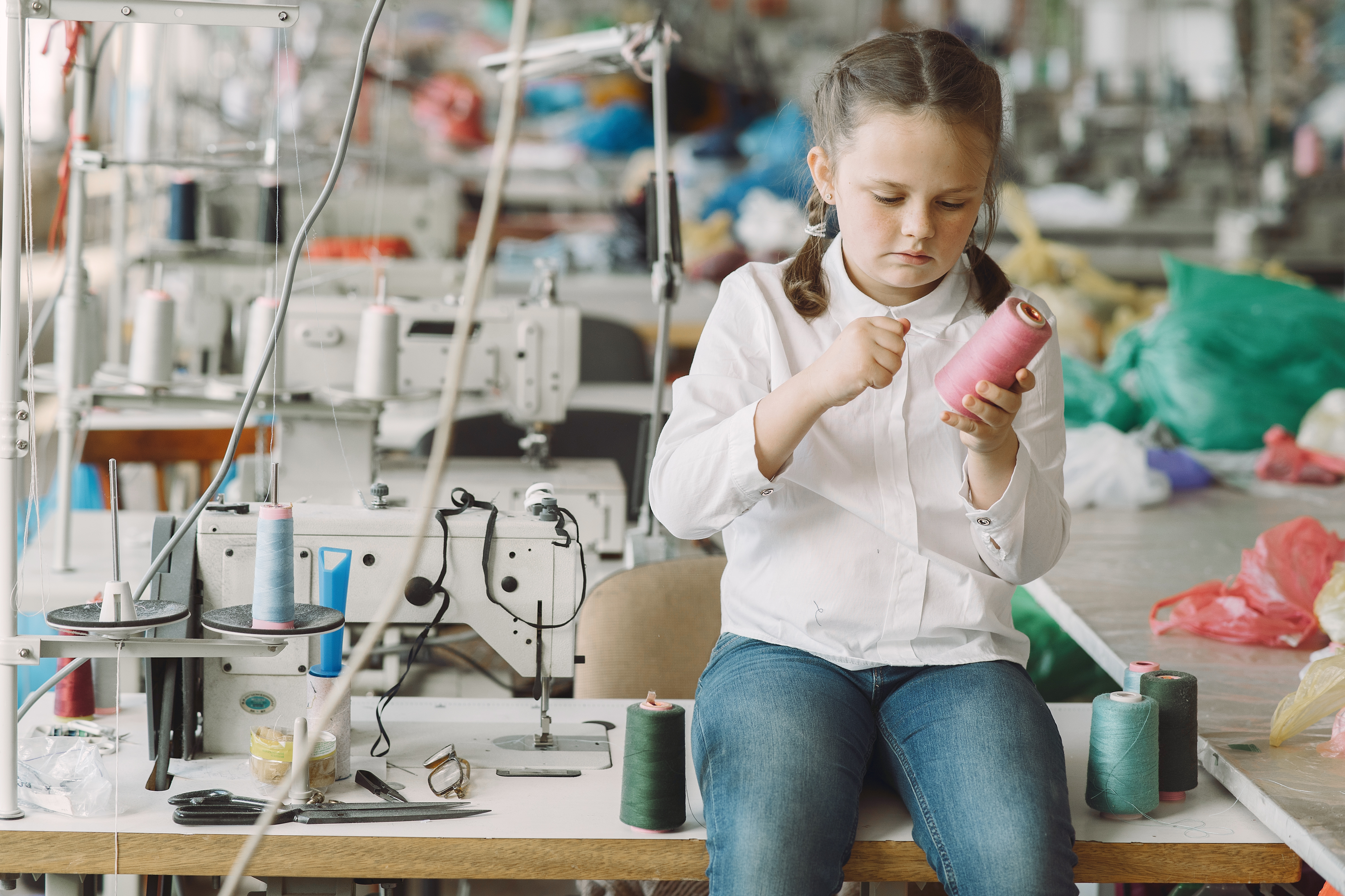 Child in a sewing workshop