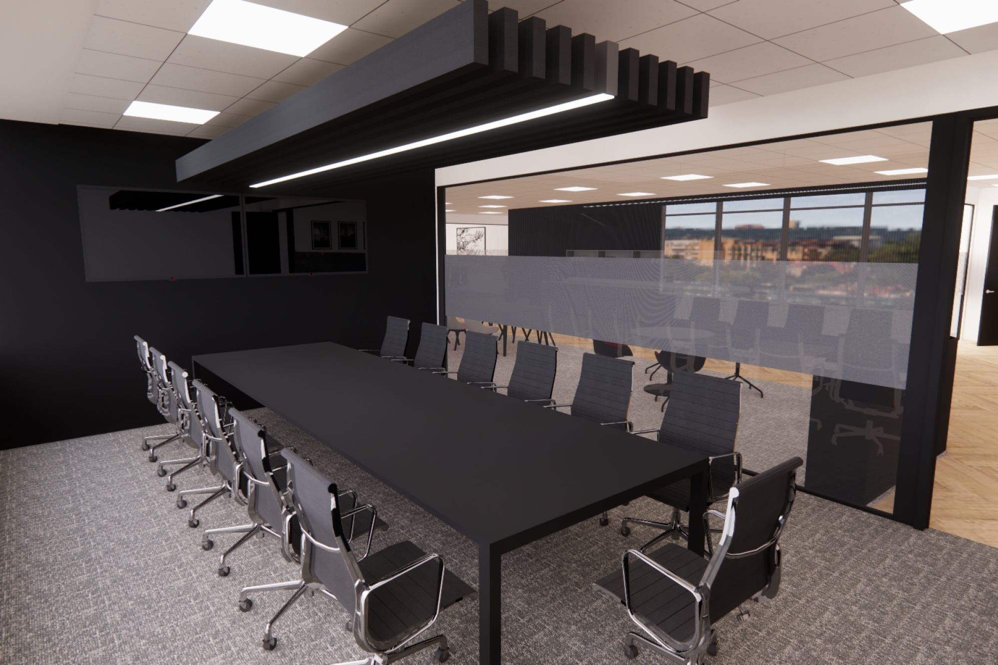 Modern conference room with a long black table surrounded by black chairs on a gray carpet. Large windows provide a view of a cityscape.