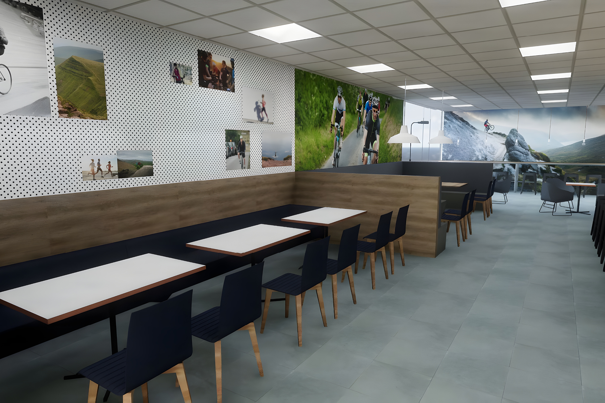 A modern cafe interior with wooden tables and black chairs. The walls display large, colourful images of outdoor activities.