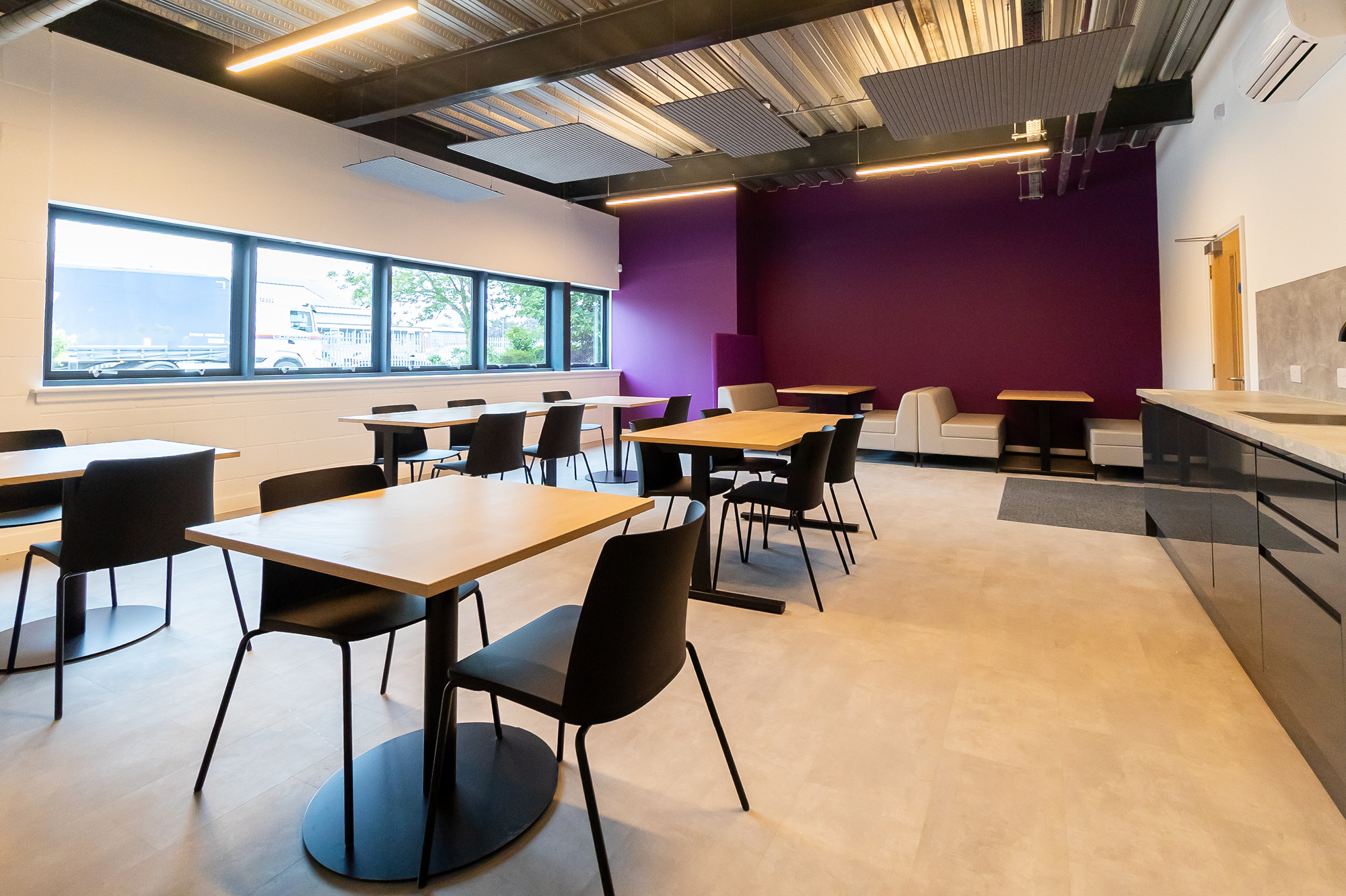 canteen area with seating arrangements of chairs and sofas