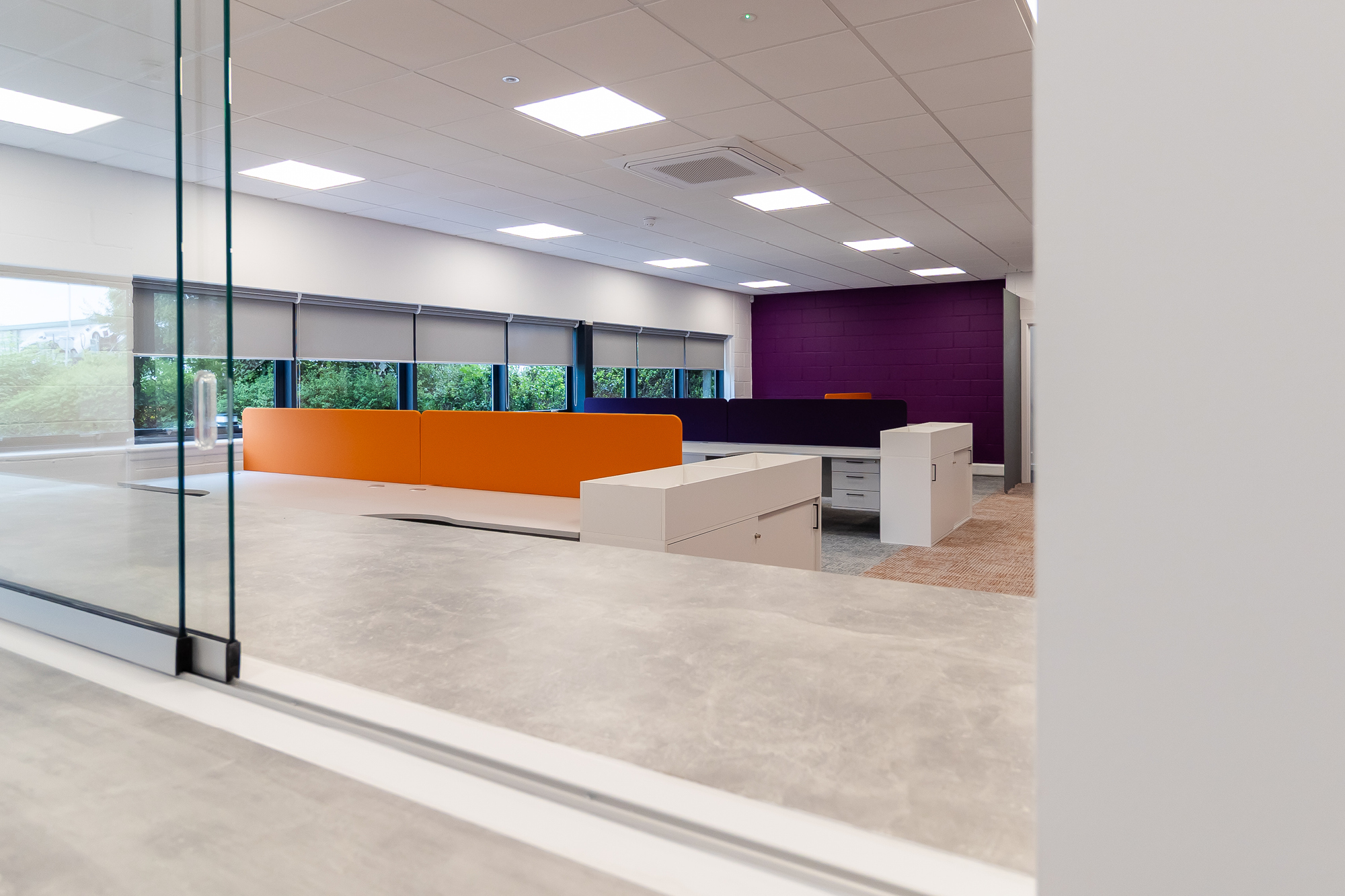 sliding glass panel opening into office space area