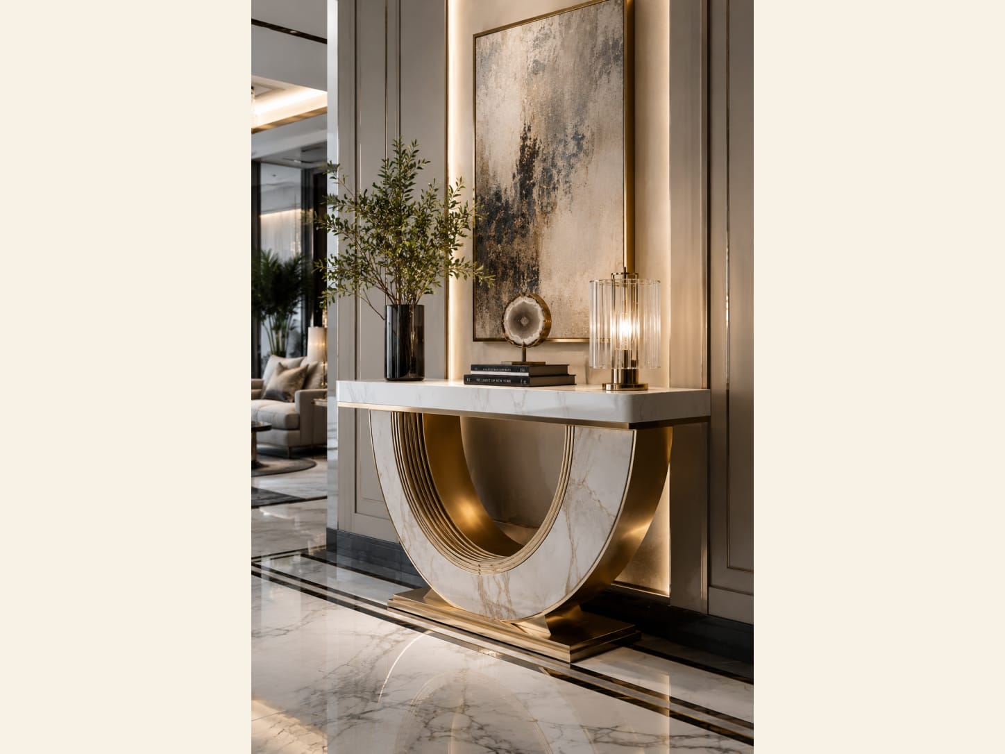 A Fluted Marble and Gold U-Console with Abstract Art A modern luxury entryway with a fluted marble-and-gold U-shaped console, a large abstract textured artwork, a glass cylinder lamp, an olive branch in a dark vase and a softly backlit niche.