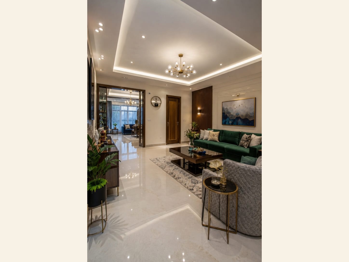 A polished open-plan living room with an emerald velvet sofa, a brass sputnik chandelier, blue abstract art and a glossy dark-wood coffee table.