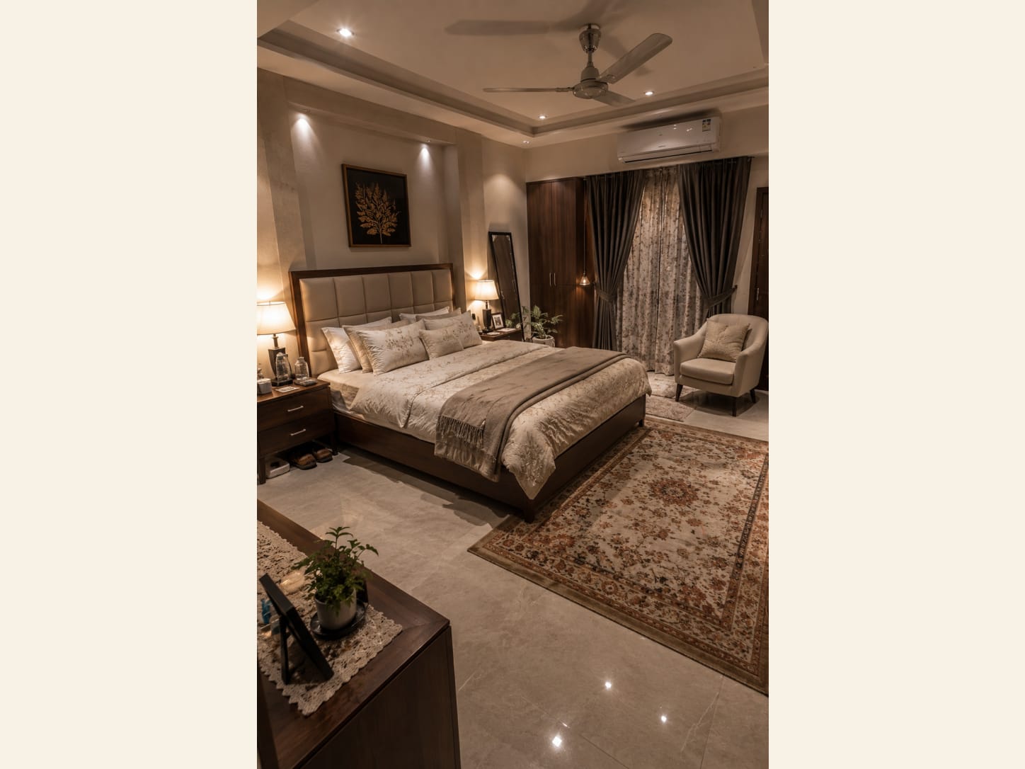 A tall tufted headboard, satin bedding and a classic patterned rug make this master bedroom feel soft, grown-up and genuinely restful.