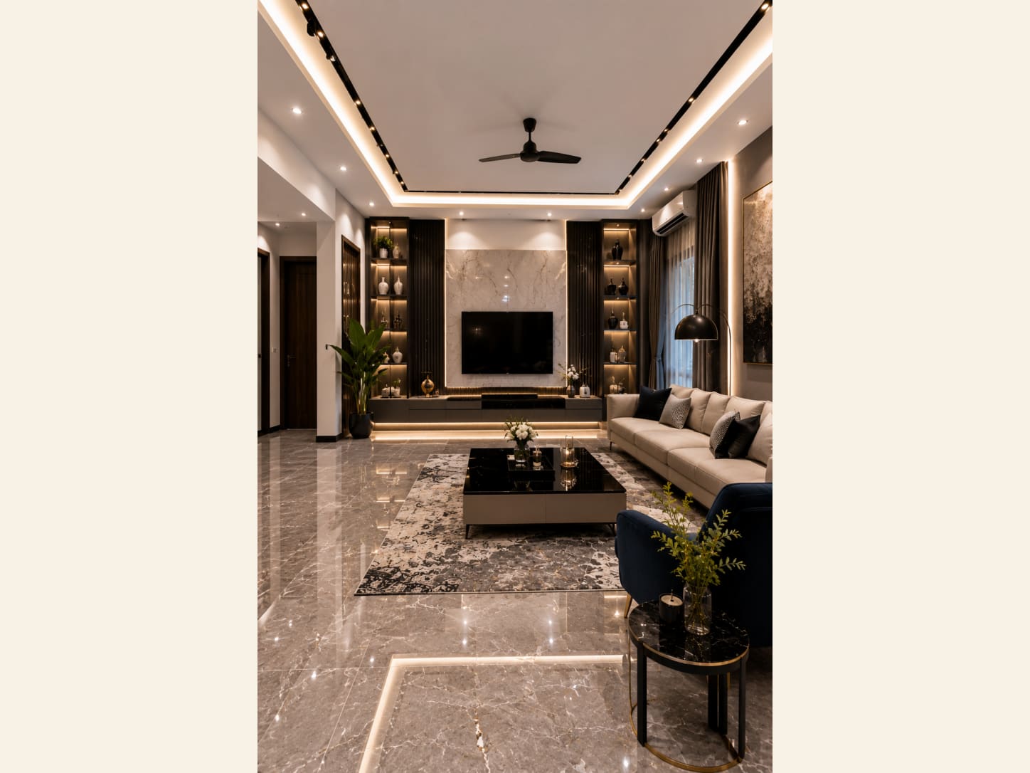 A White Marble TV Wall Living Room That Balances Bright and Bold A bright modern living room with a white marble TV wall, backlit display niches, a cream sofa and navy accents over glossy floors.