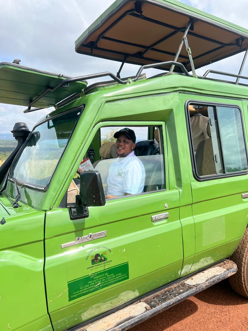 Wildlife Tours Rwanda guide in a safari vehicle