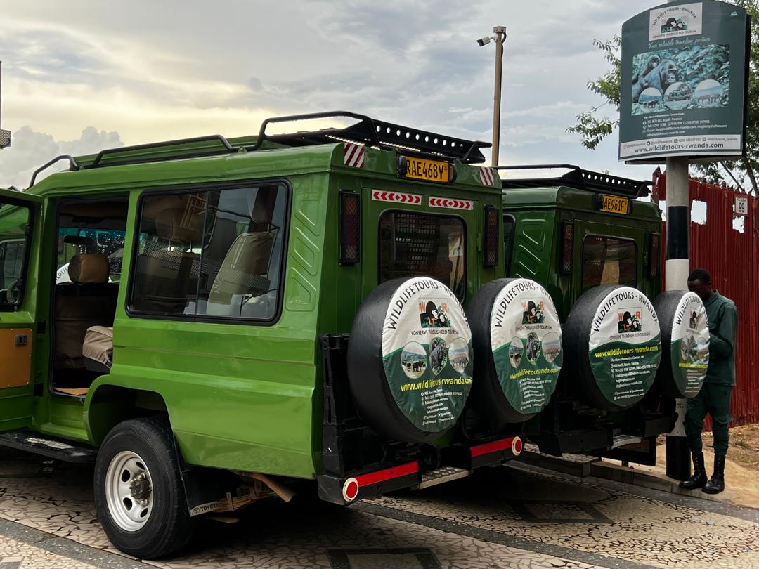 Branded safari vehicles prepared for a journey
