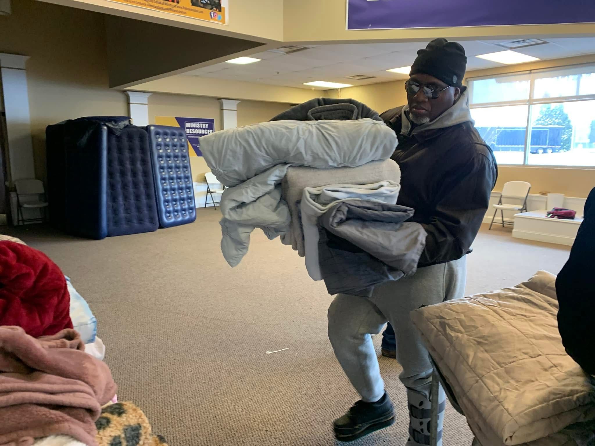 Warming shelter with people finding refuge from cold weather