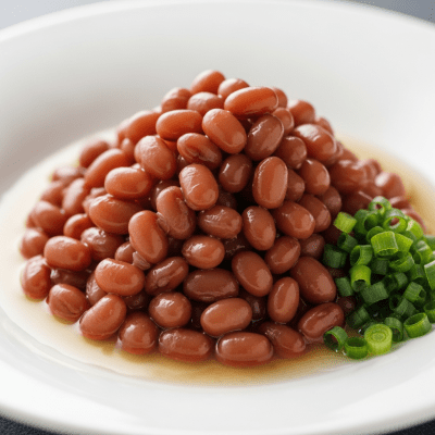 Image of cooked or prepared Adzuki Bean (legumes) as it appears in a traditional dish or common culinary usage, presented on a clean plate with minimal garnish