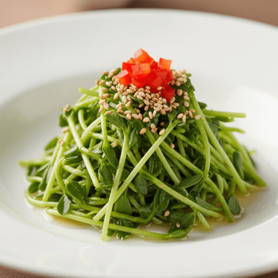 Image of cooked or prepared Alfalfa (legumes) as it appears in a traditional dish or common culinary usage, presented on a clean plate with minimal garnish