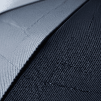 A close-up macro photograph focusing on the texture and pattern of the canopy fabric of a Automatic Folding Umbrella (umbrellas)