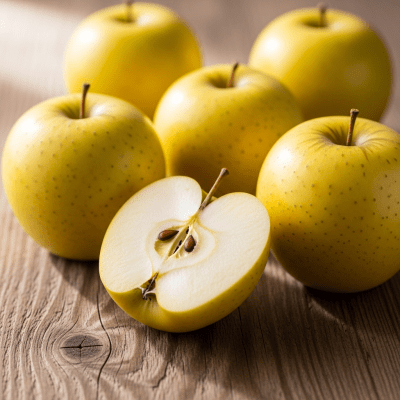 A simple arrangement showing several whole and one cut-open Ginger Gold, displayed on a wooden surface