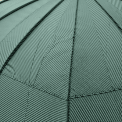 A close-up macro photograph focusing on the texture and pattern of the canopy fabric of a Golf Umbrella (umbrellas)