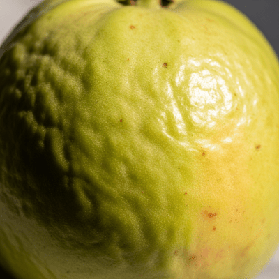 Macro shot capturing the surface texture and color details of the Guava, within the fruits taxonomy