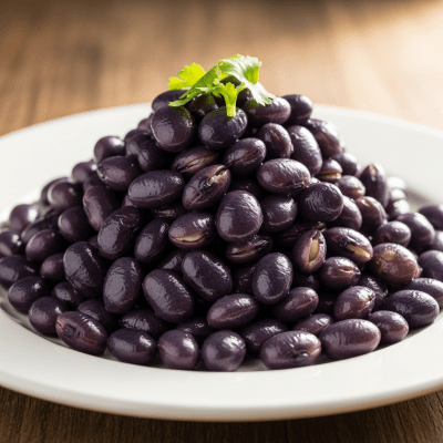 Image of cooked or prepared Indigo (legumes) as it appears in a traditional dish or common culinary usage, presented on a clean plate with minimal garnish