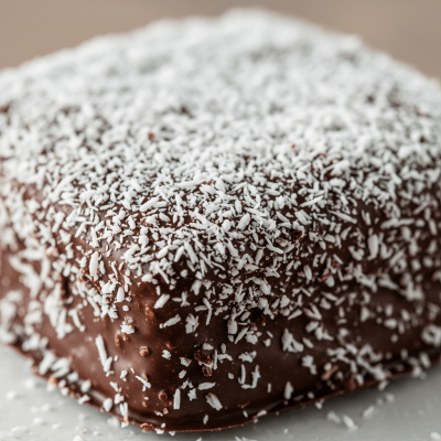 Close-up macro photograph of the surface texture and decoration of a Lamington (cake)