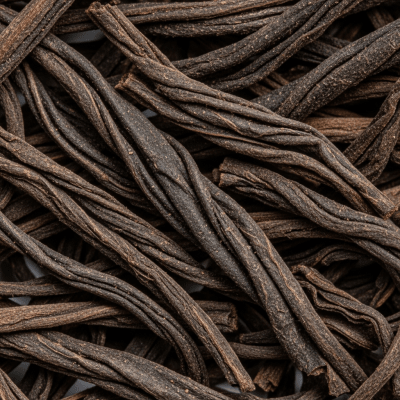 Macro photograph focusing on the texture and details of Lapsang Souchong leaves, within the taxonomy teas