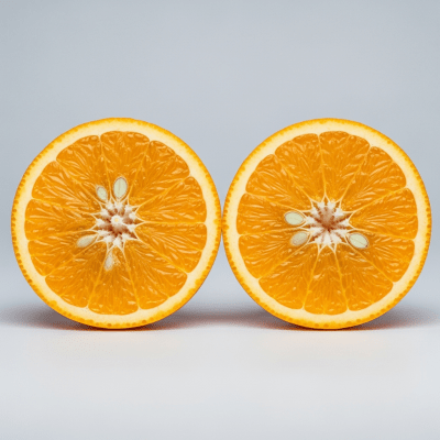 A detailed close-up cross-sectional image of a Navelina Orange from the oranges taxonomy, sliced cleanly in half to reveal the interior segments, pulp, and rind structure