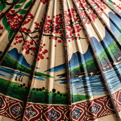 A close-up macro photograph focusing on the texture and pattern of the canopy fabric of a Oil-paper Umbrella (umbrellas)