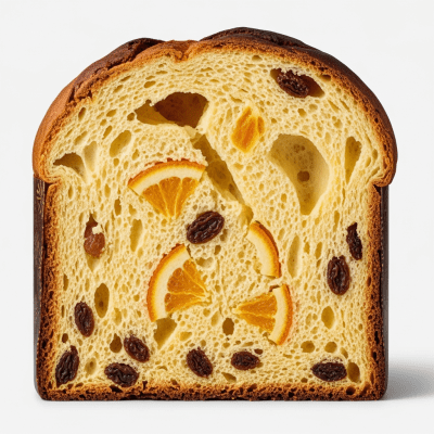 Detailed cross-sectional view of a sliced Panettone (cake), showing internal layers, textures, and ingredients