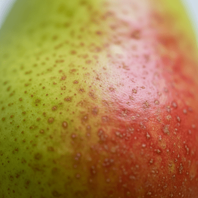 Macro shot capturing the surface texture and color details of the Pear, within the fruits taxonomy