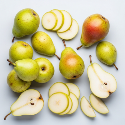An overhead view photograph of several pieces of the Pear, from the fruits taxonomy, arranged aesthetically on a plain background