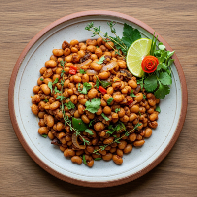 Image of cooked Pigeon Pea (beans) presented as part of a traditional dish or cuisine, plated attractively and photographed from above