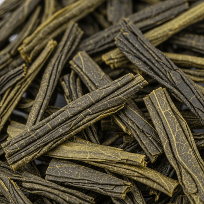 Macro photograph focusing on the texture and details of Sencha leaves, within the taxonomy teas